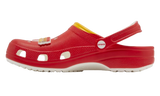 Red Crocs clogs with a McDonald's french fry Jibbitz and yellow trim.