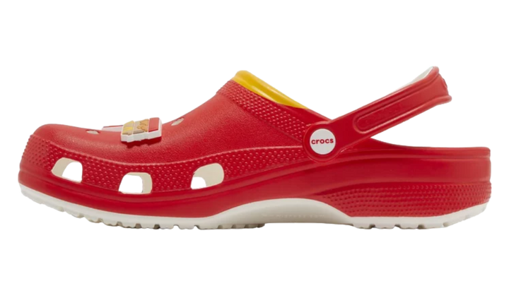 Red Crocs clogs with a McDonald's french fry Jibbitz and yellow trim.