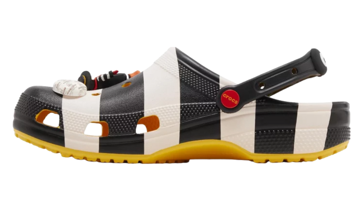 Crocs x McDonald's 'Hamburglar' clog with black and white stripes and yellow sole.