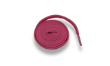Pink shoelaces rolled into a coil.