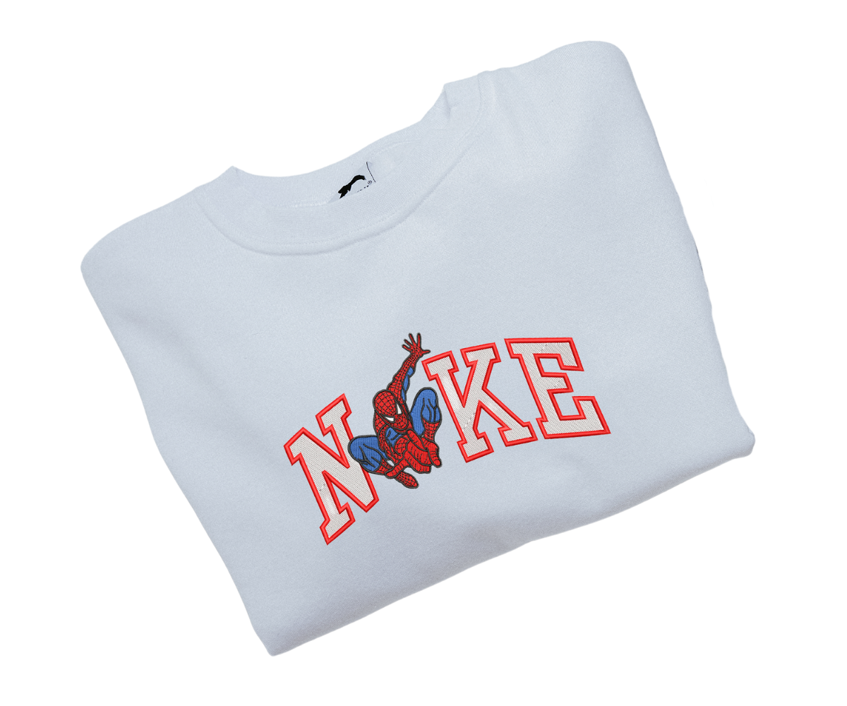 Világoskék pulóver piros "NIKE" felirattal és Spiderman hímzéssel.