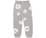 Grey sweatpants with a white floral wreath pattern and a drawstring waist.