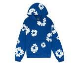 Denim Tears The Cotton Wreath Sweatshirt Royal Blue with white floral print.