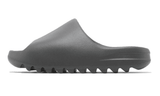 Yeezy Slide Granite, a dark gray slip-on sandal with a contoured sole.