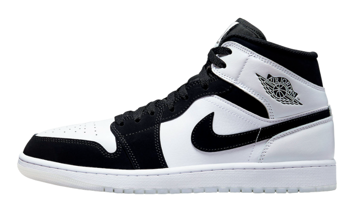 Air Jordan 1 Mid fekete-fehér bőr és velúr sneaker.