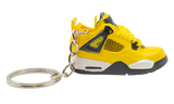 Kulcstartó Air Jordan 4 Retro Lightning cipő formájában, sárga színben.
