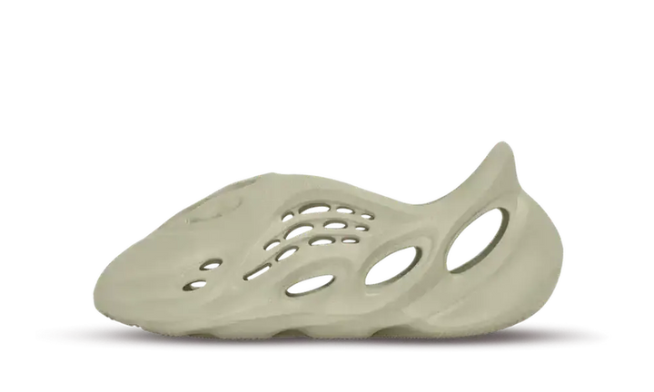 A light beige Yeezy Foam RNNR shoe with various perforations.