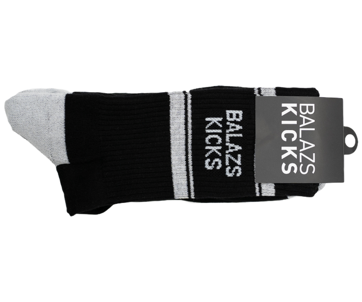 Balazs Kicks black socks with white stripes and a tag.