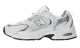 New Balance 530 white and silver metallic sneakers.