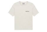 Fear of God Essentials Core Collection T-shirt in off-white with a small logo.