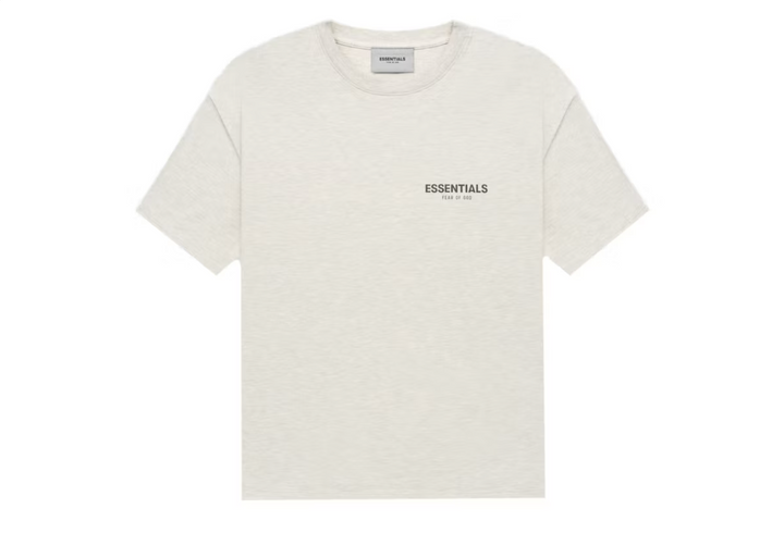 Fear of God Essentials Core Collection T-shirt in off-white with a small logo.