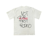 White t-shirt with black and pink "NOT OUR FIRST RODEO 10 YEARS" graphic print.