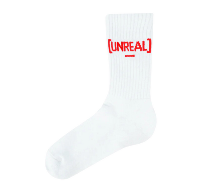 White socks with a red "UNREAL" logo.