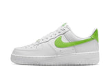 Nike Air Force 1 low-top sneakers in white with action green accents.