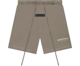Fear of God Essentials desert taupe shorts with logo tag and drawstring.