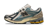 New Balance 1906R Metallic Teal New Spruce sneaker with mesh and metallic teal accents.