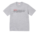 Heather grey Supreme t-shirt with red and black text graphic.