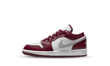 Air Jordan 1 Low Bordeaux sneaker with white and maroon panels and a silver Nike swoosh.