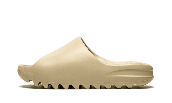 Yeezy Slide Pure in a neutral tan color.