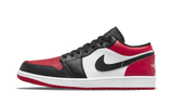 Air Jordan 1 Low Bred Toe sneaker with black, white, and red leather accents.
