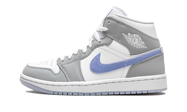Air Jordan 1 Mid Aluminium Wolf Grey sneaker with white and grey overlays and a blue swoosh.