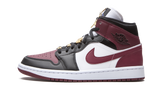 Air Jordan 1 Mid SE Black Dark Beetroot sneaker with gold accents.