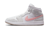 Air Jordan 1 Mid SE Light Iron Ore sneaker with white, grey, and pink accents.