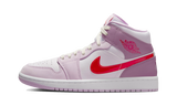 Air Jordan 1 Mid Valentine's Day 2022 with white leather, pink overlays, and red accents.