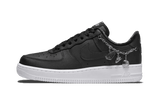 Fekete bőr Nike Air Force 1 Low LX tornacipő ezüst "Lucky Charms" díszítéssel.