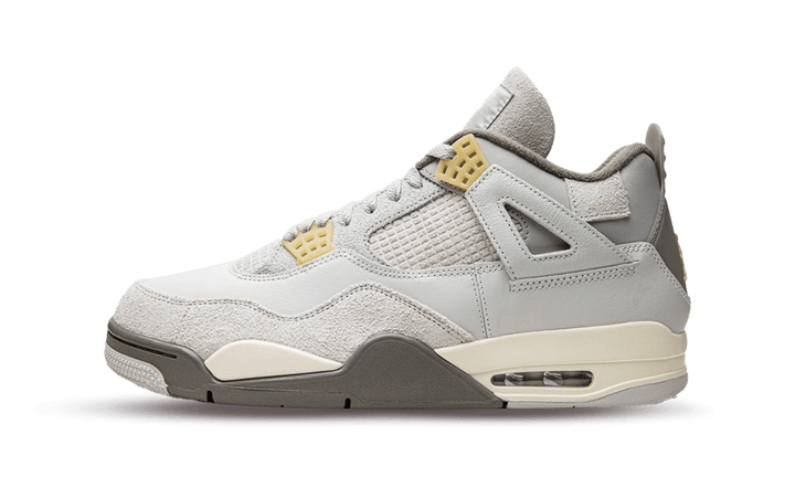 Air Jordan 4 Retro SE Craft Photon Dust sneaker in shades of gray with yellow accents.