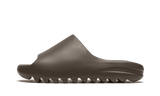 Yeezy Slide Soot, a brown slip-on sandal with a contoured sole.